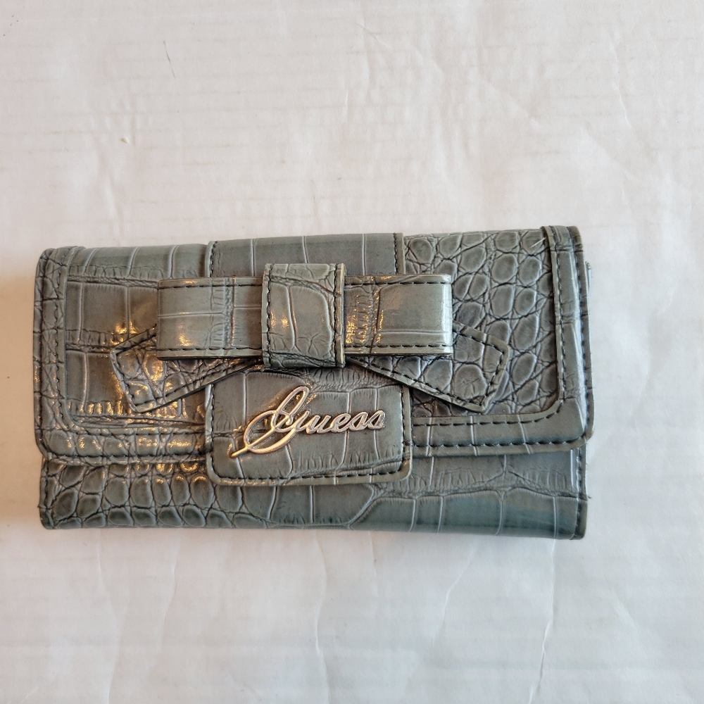 Guess Gray With Silver & Bow Accent Crocodile Embossed Wallet. 7" Wide 4" High